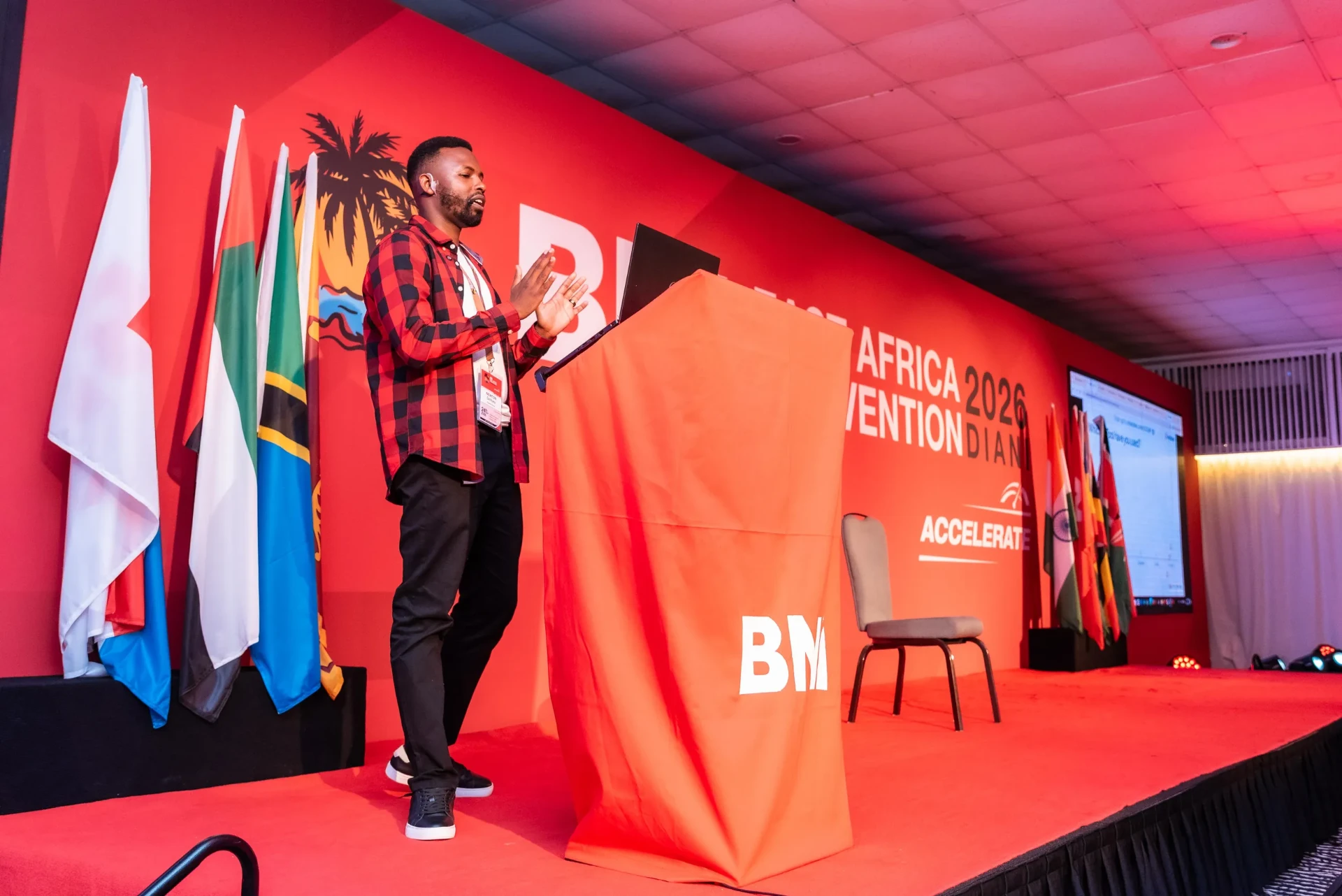 Newton Gichuru speaking on stage at the BNI East Africa Convention 2026 in Diani