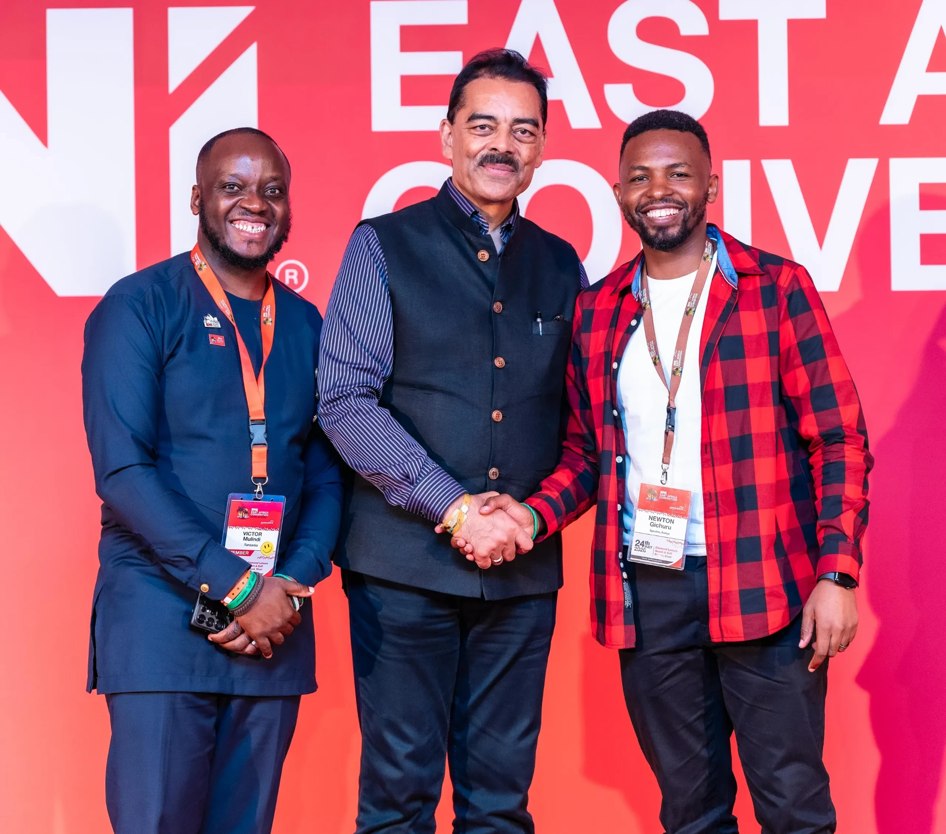 Newton Gichuru shaking hands with BNI leadership at the East Africa Convention